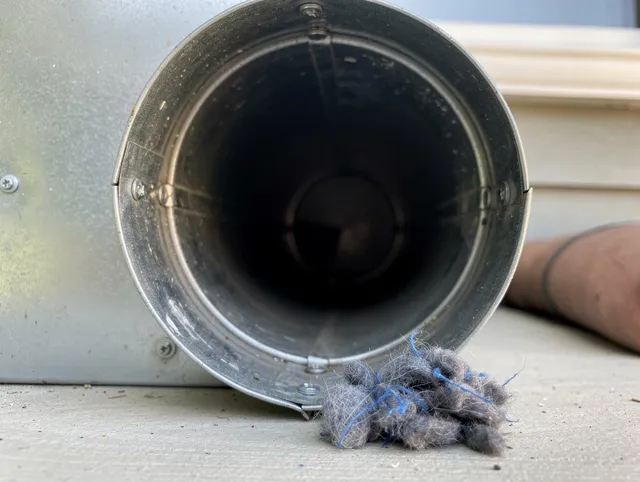 Mahoning Dryer Vent Cleaning technician using specialized equipment to clear severe dryer vent blockage in Mahoning